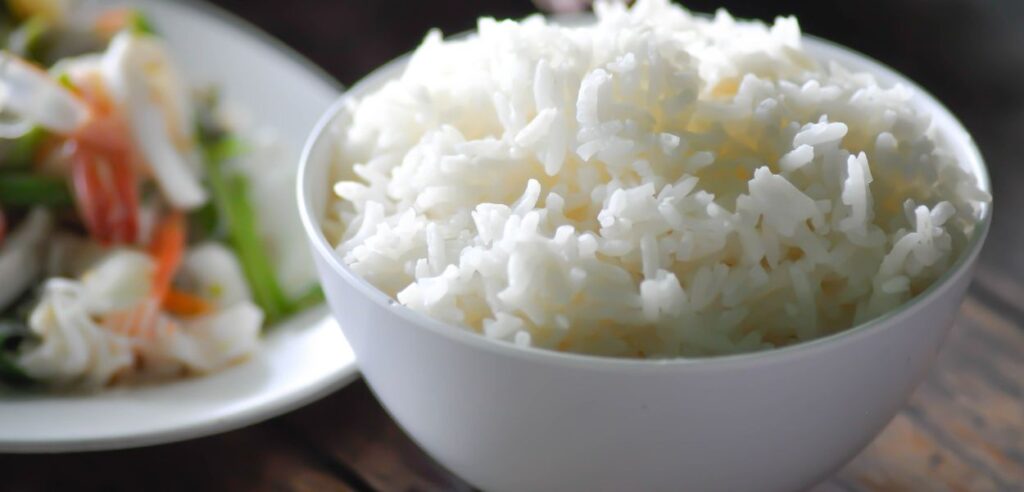 bowl of fluffy white rice sitting on a table